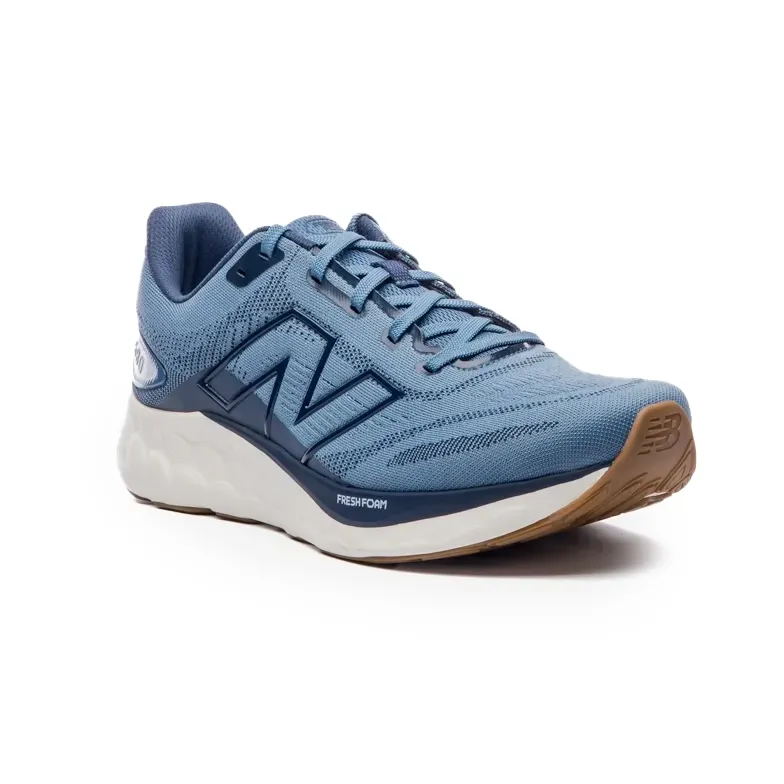 Tênis New Balance Fresh Foam 680v8 Masculino Azul Marinho vista lateral mostrando design e conforto